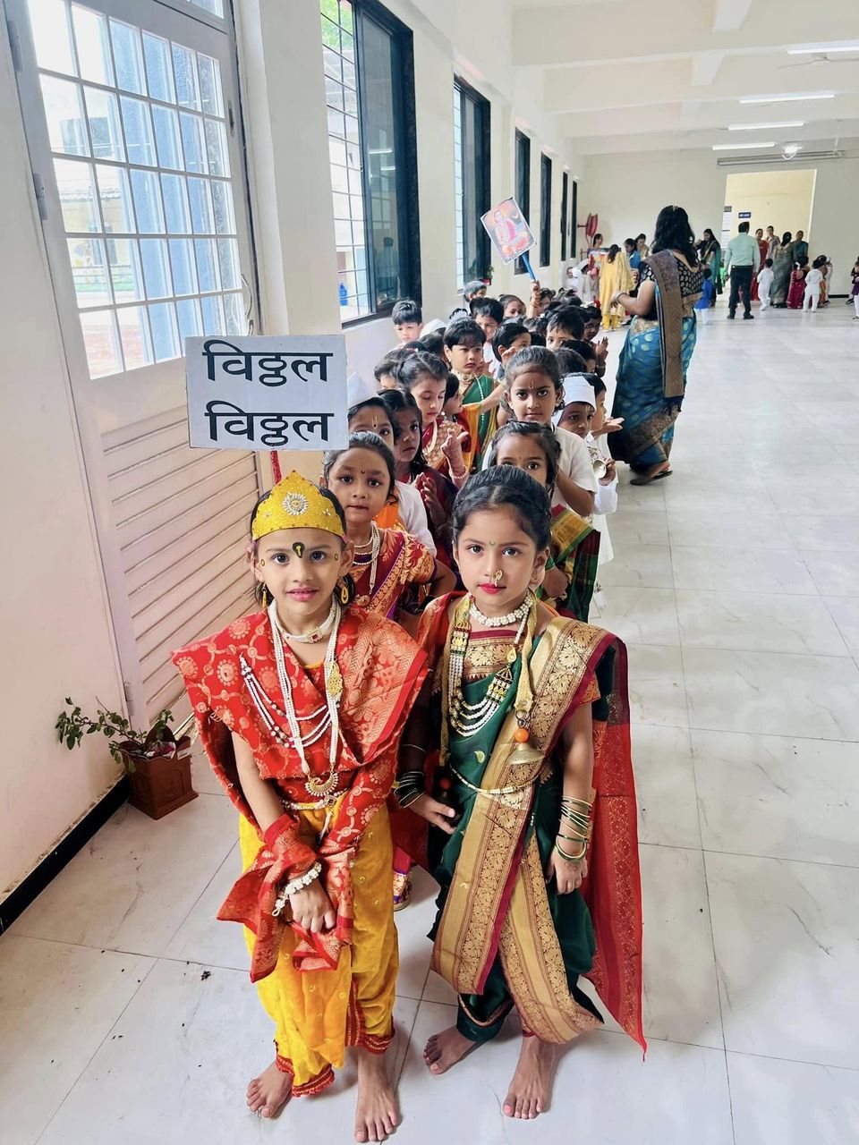 Children in traditional dress lined up for the Ashadhi Ekadashi dindi