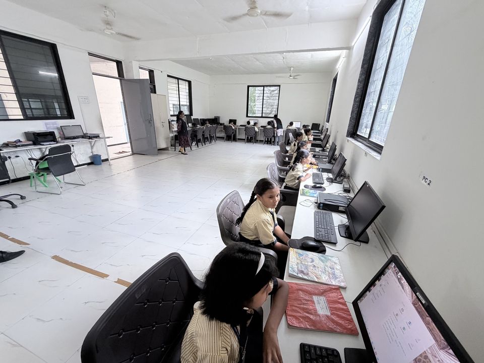 Students at the desktop computers in the computer laboratory