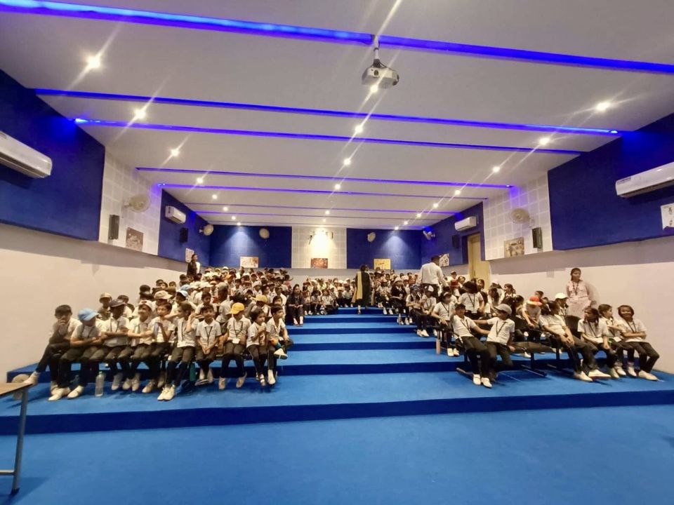 Students seated in the school hall