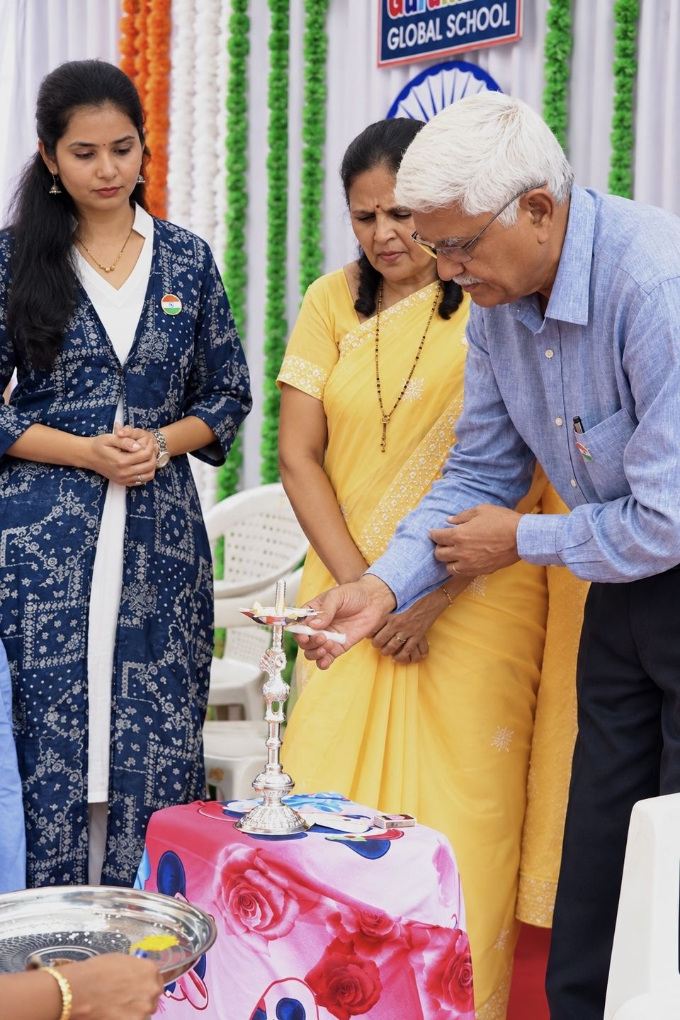 Trust members light the lamp at the inauguration of the school