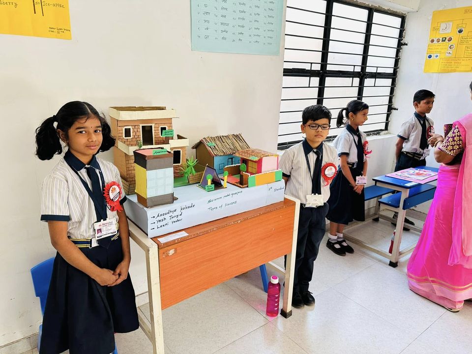 A student with her model at the science exhibition