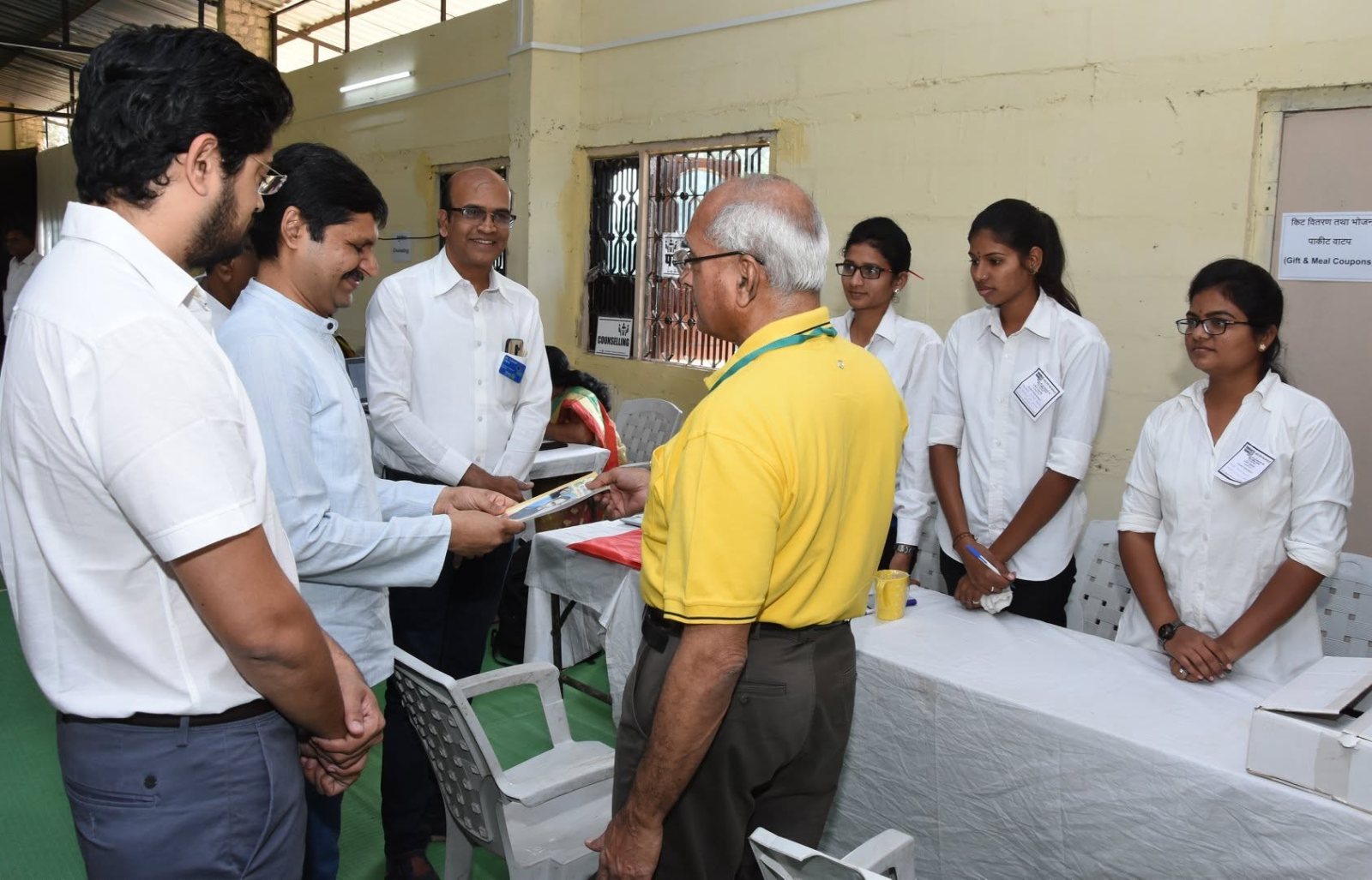 A certificate is presented at the camp