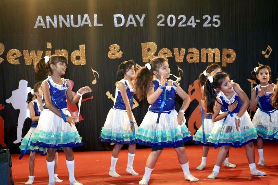 The junior dance troupe mid-step