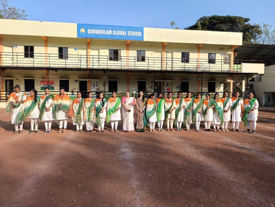 The staff in front of the school building