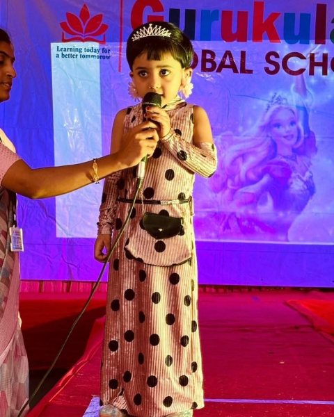 A princess with her tiara at the microphone
