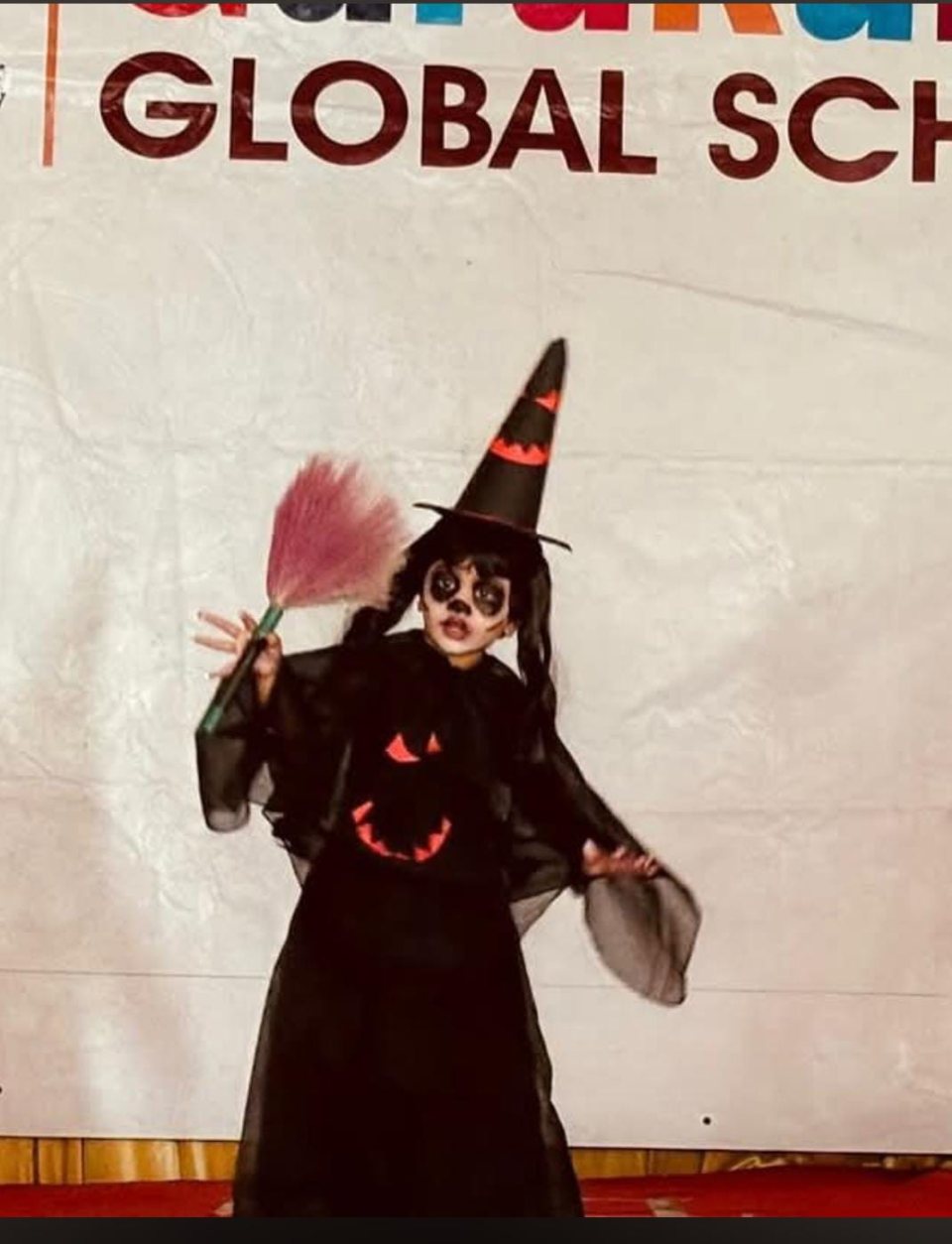 A witch with her broom