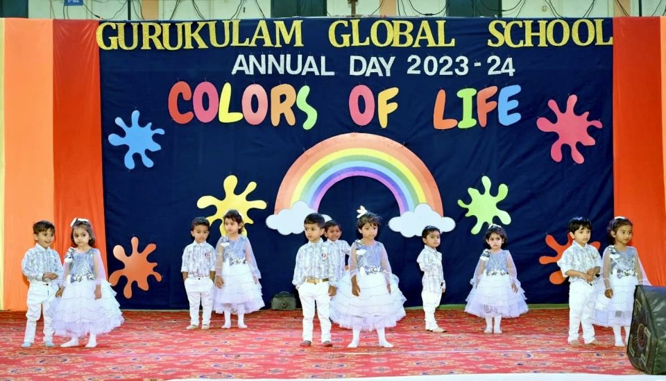 Pre-primary children in white for their first stage act
