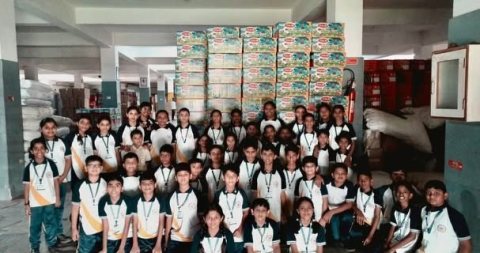 The group photograph in the packing hall
