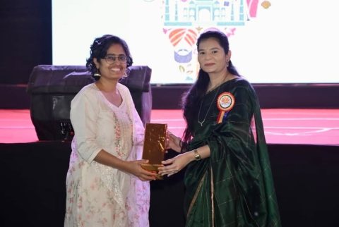 A guest is felicitated on stage after the programme