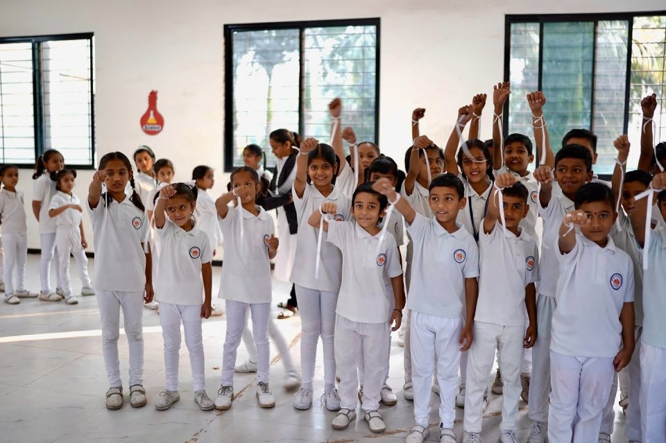 Hands up in the school hall