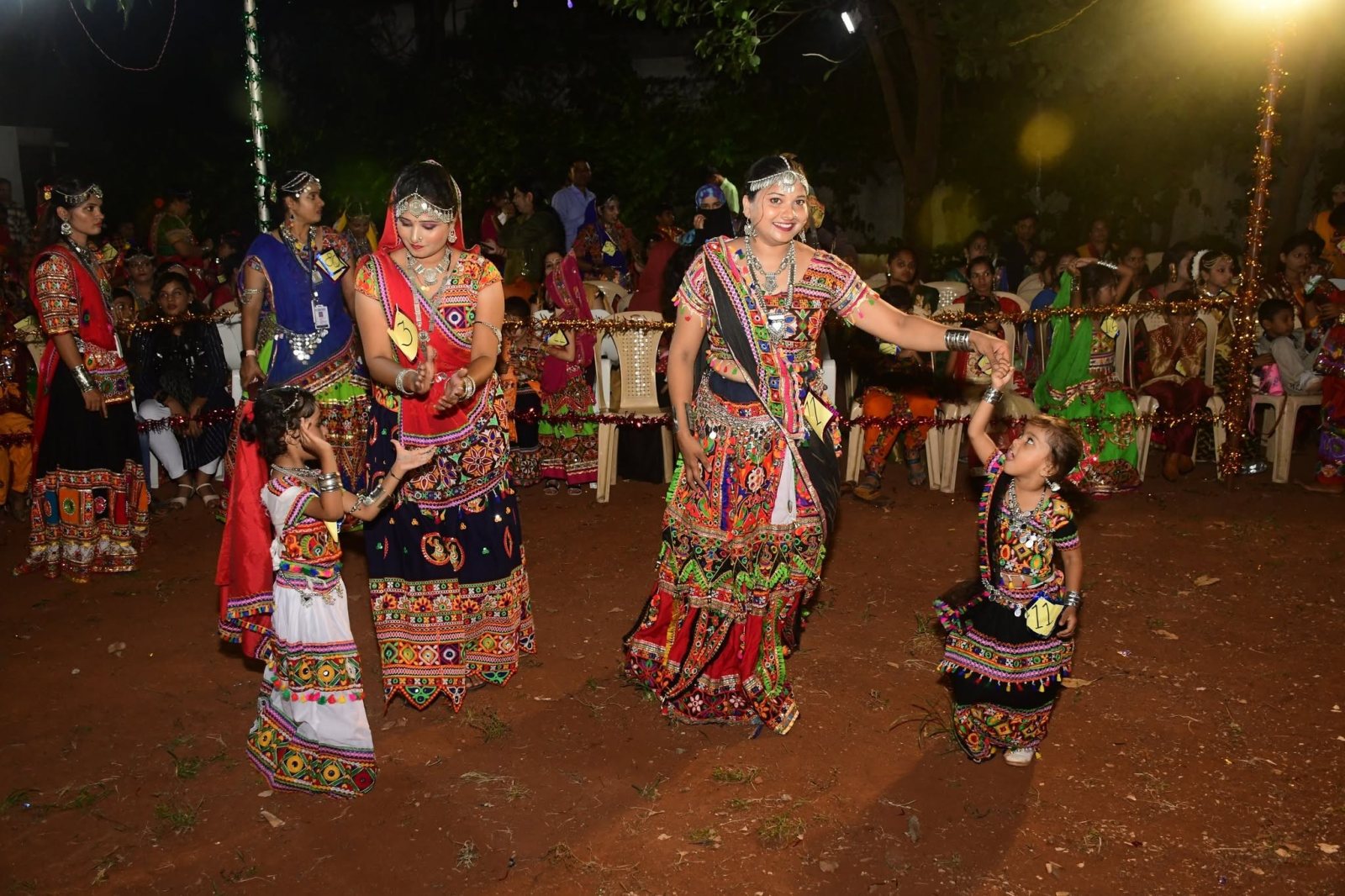 Teachers and children in the garba circle