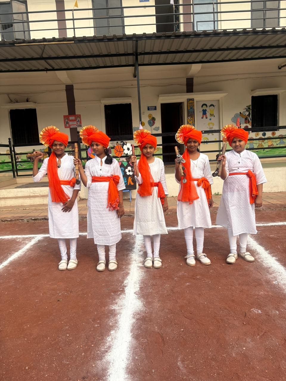 Lezim dancers ready in saffron