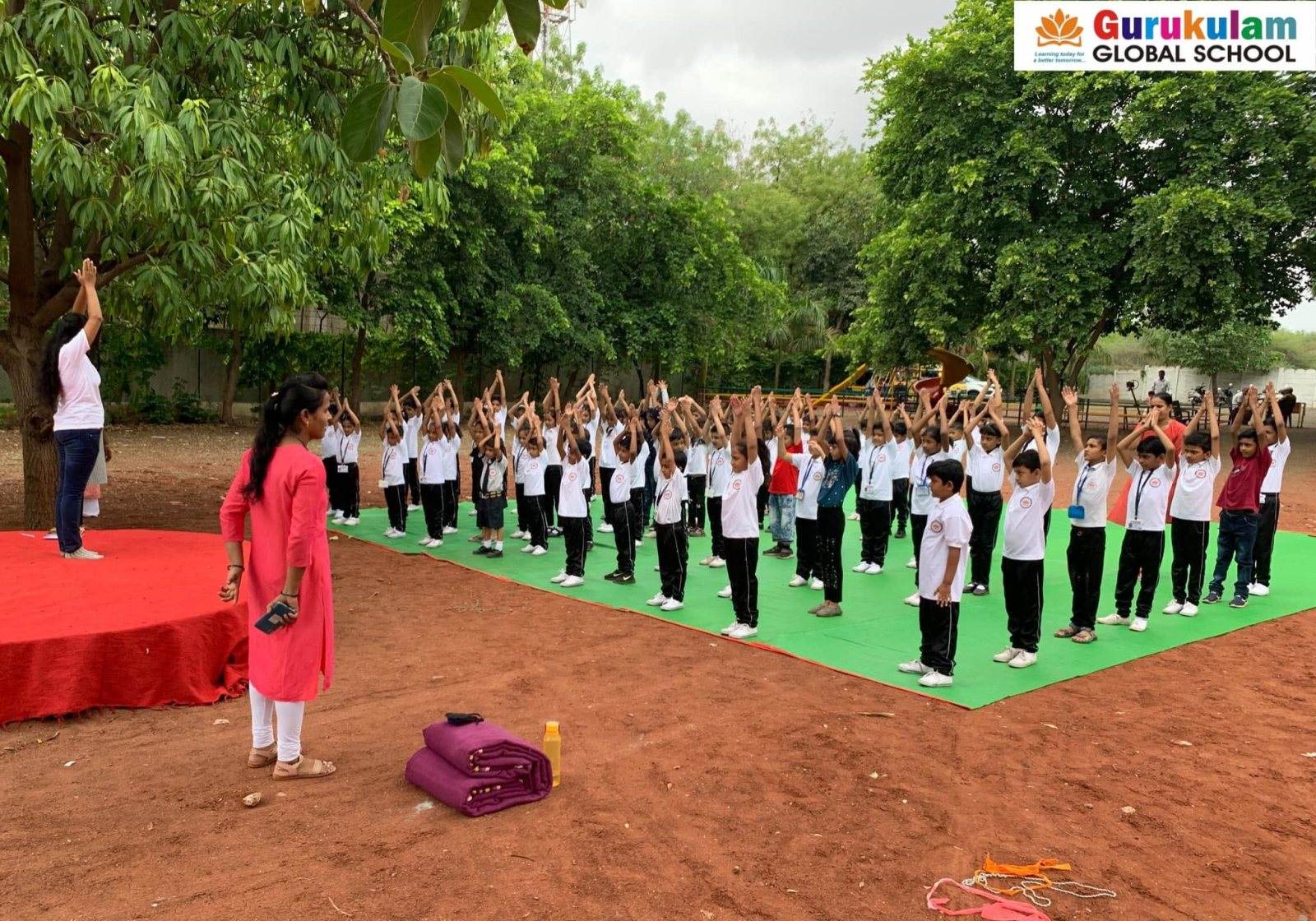 Yoga under the trees, led from the front