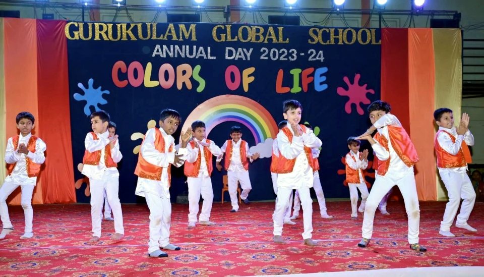 Senior boys in orange jackets open the show