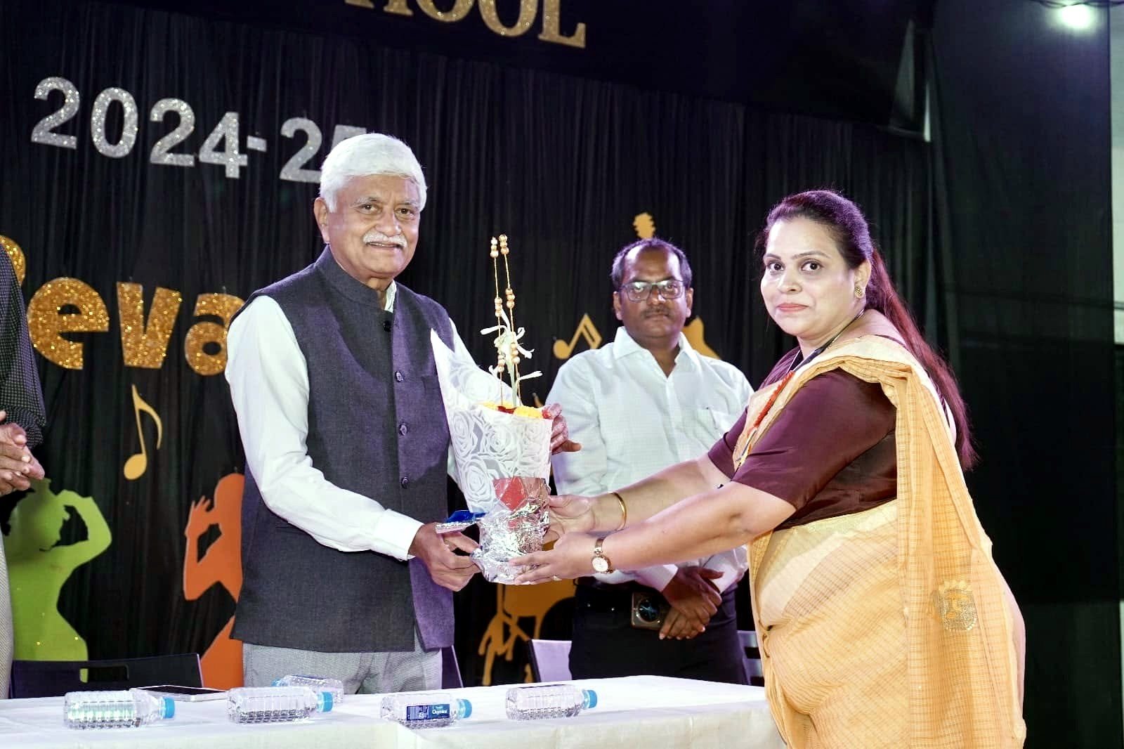 A guest is felicitated by the school before the programme