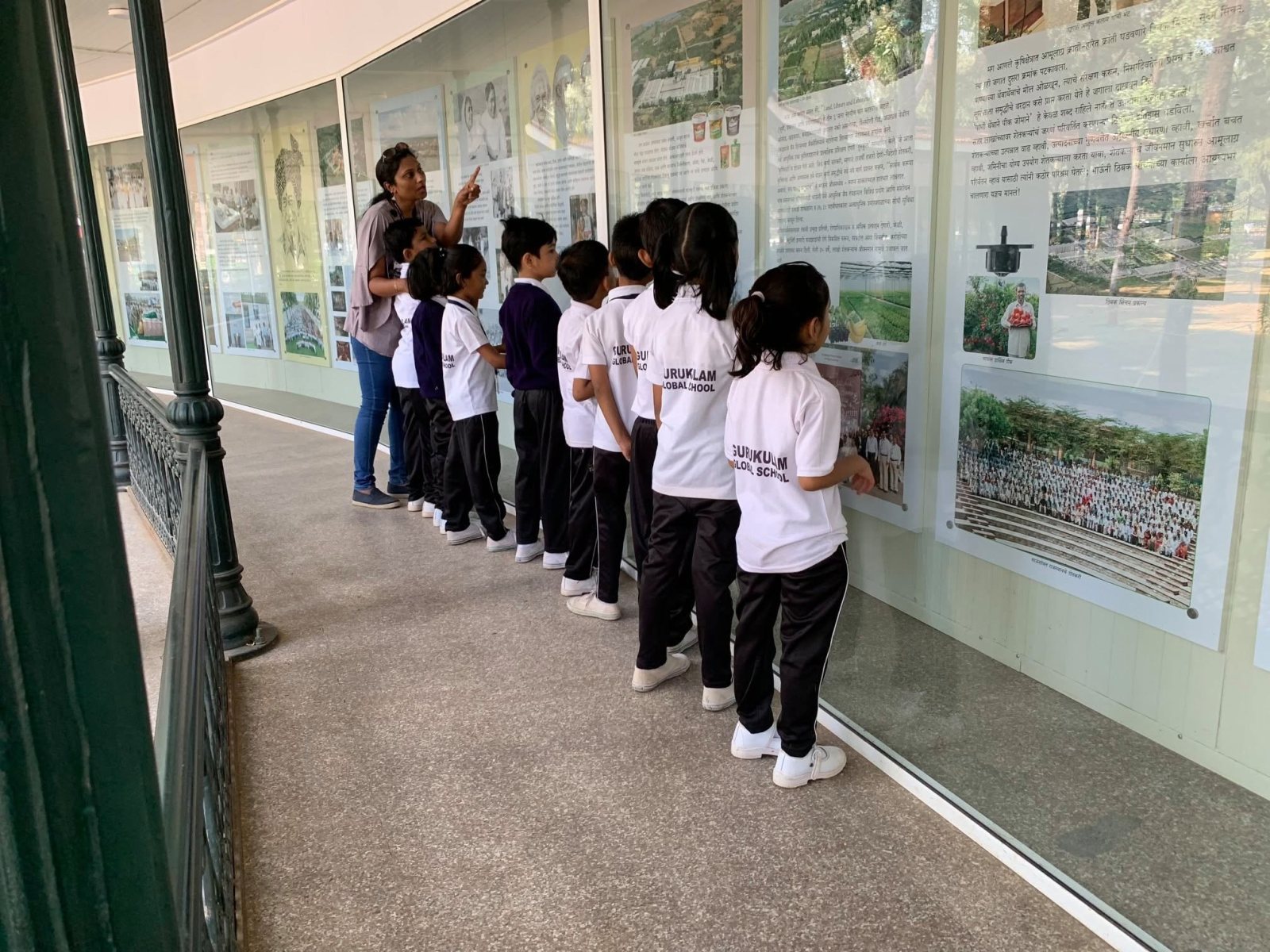 Reading the panels at the exhibition gallery
