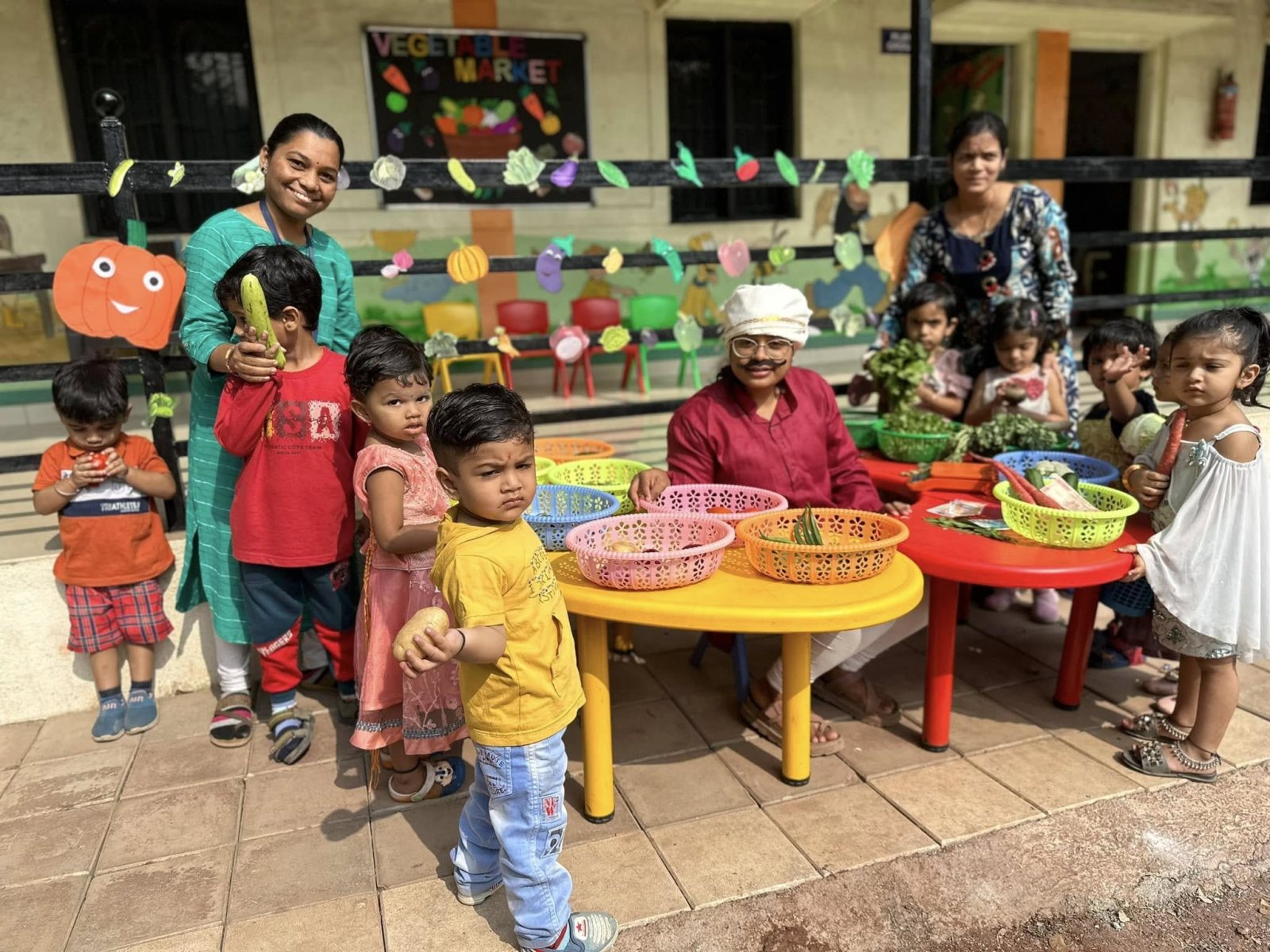 Buying vegetables at the pretend market