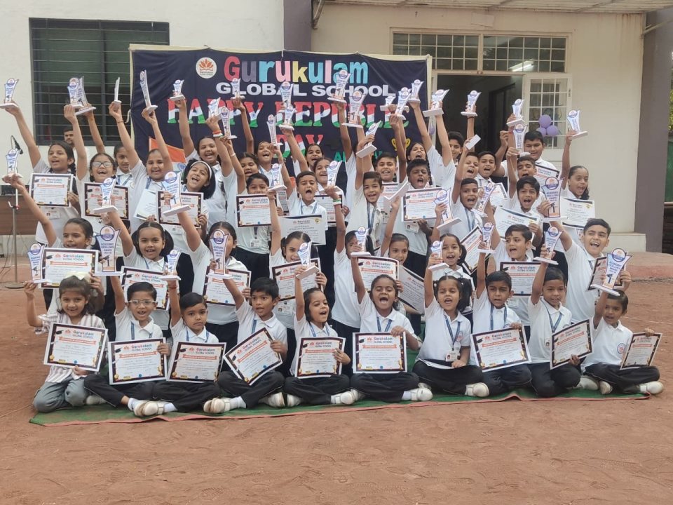 Students holding up their Academic Excellence Award trophies and certificates on the school ground