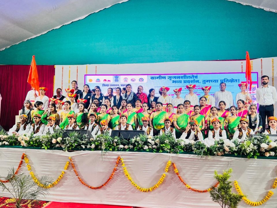 The Gurukulam dance troupe in traditional costume on the stage of the district-level dance competition